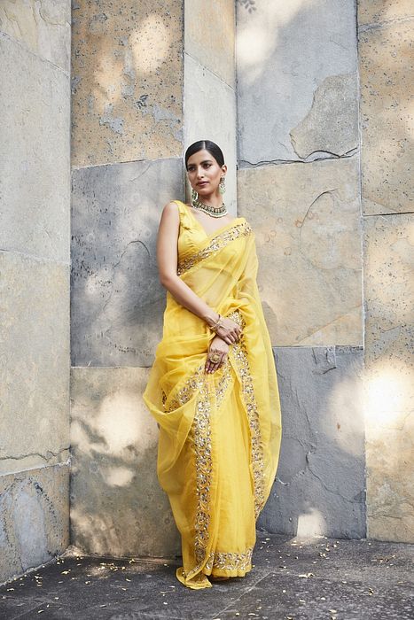 A model showcasing Yellow Silk Organza Saree by Ranian from Ranian's collection