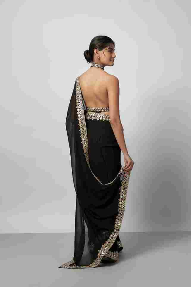 A model showcasing Ragini Saree Set by Gopi Vaid from Gopi Vaid's collection