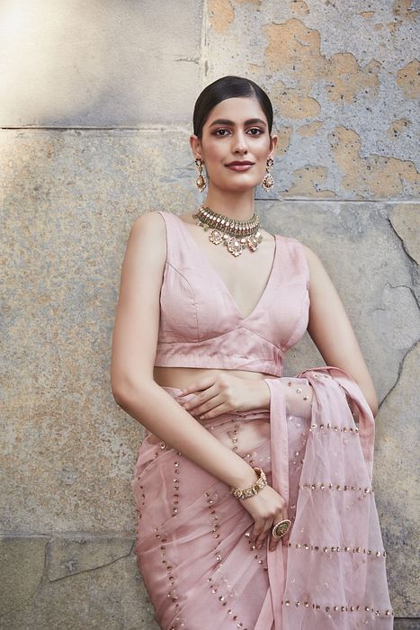 A model showcasing Blush Pink Silk Organza Saree by Ranian from Ranian's collection A model showcasing Blush Pink Silk Organza Saree by Ranian from Ranian's collection