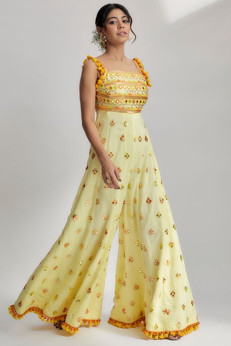 A model showcasing Yellow Fara Jumpsuit by Gopi Vaid from Gopi Vaid's collection