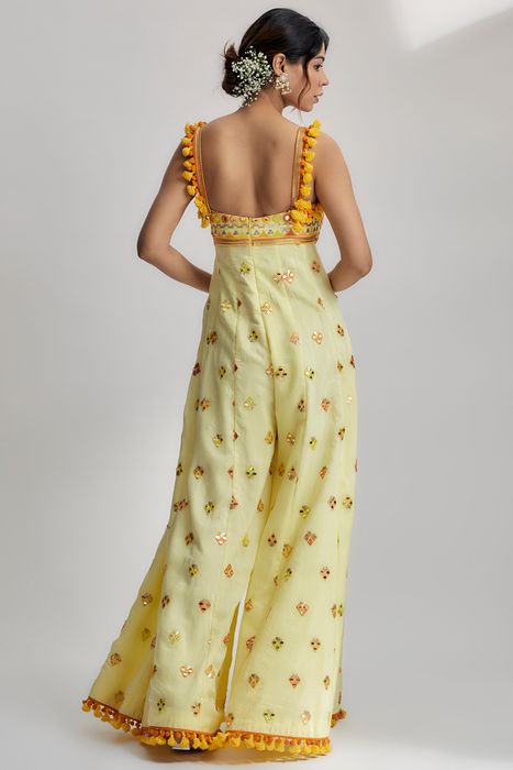 A model showcasing Yellow Fara Jumpsuit by Gopi Vaid from Gopi Vaid's collection