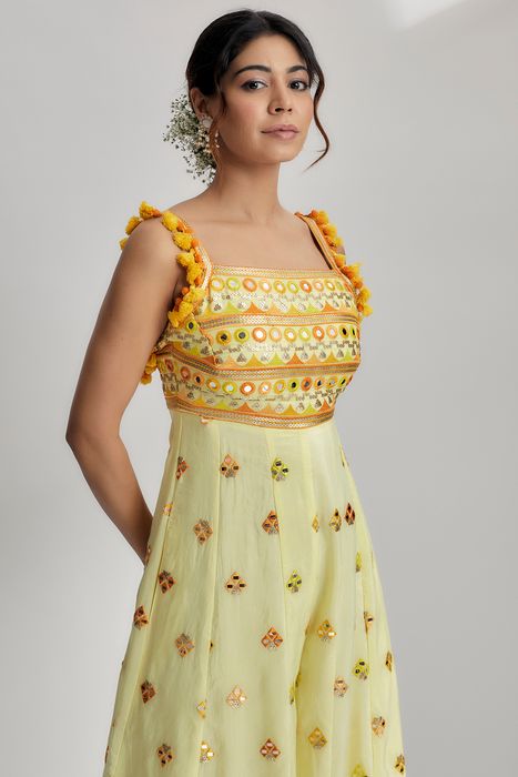 A model showcasing Yellow Fara Jumpsuit by Gopi Vaid from Gopi Vaid's collection