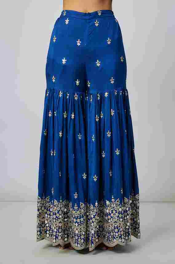A model showcasing Inika Sharara Set by Gopi Vaid from Gopi Vaid's collection