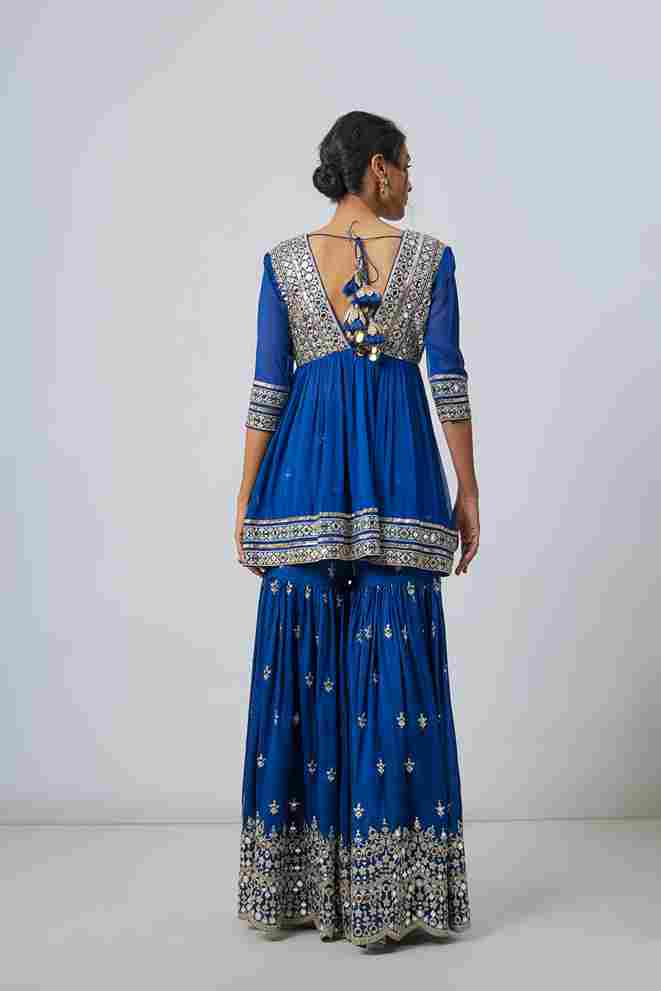 A model showcasing Inika Sharara Set by Gopi Vaid from Gopi Vaid's collection