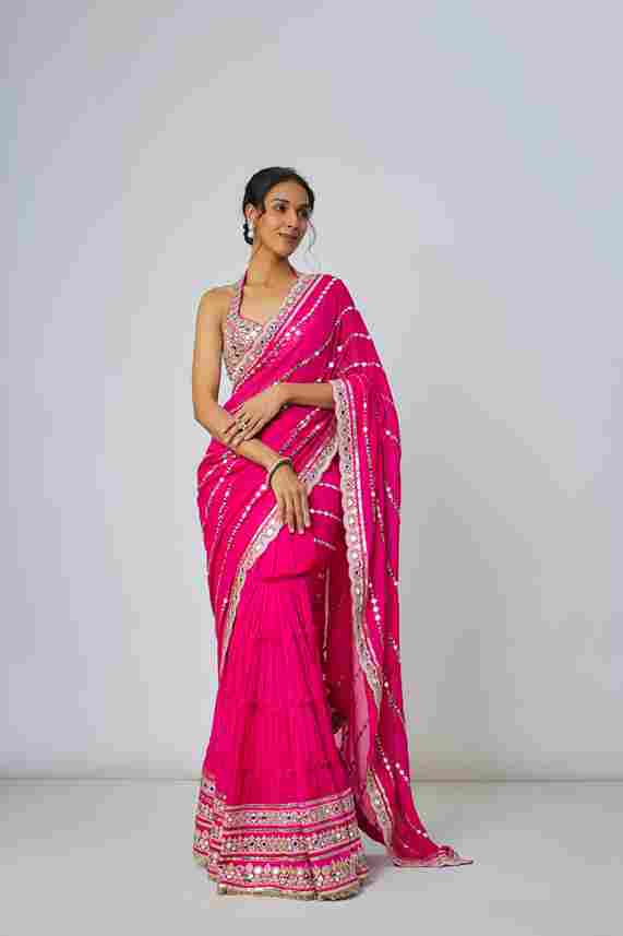 A model showcasing Pink Aradhana Saree Set by Gopi Vaid from Gopi Vaid's collection