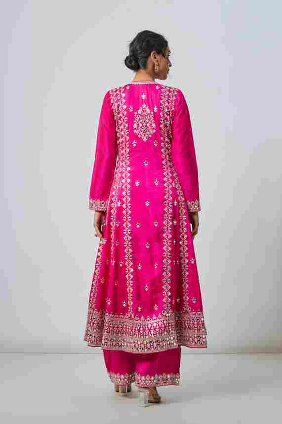 A model showcasing Rani Pink Amiha Ag Set by Gopi Vaid from Gopi Vaid's collection