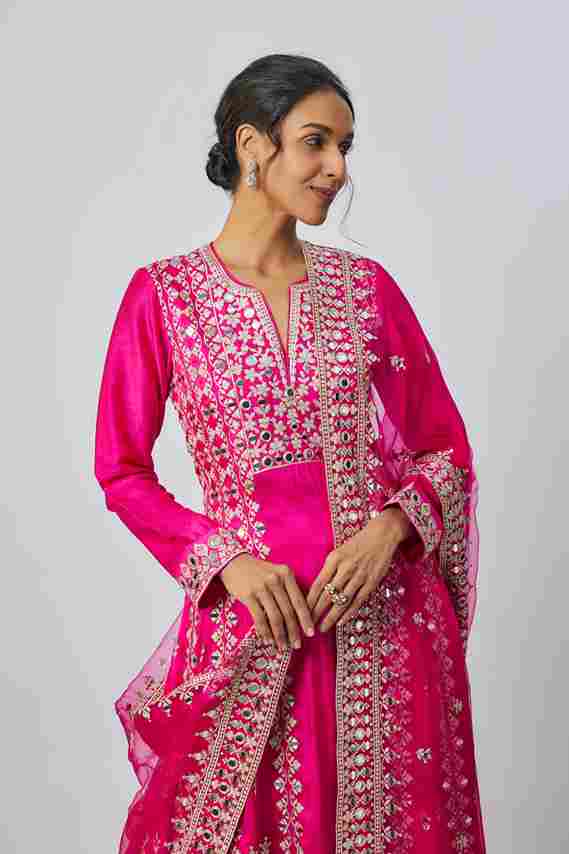 A model showcasing Rani Pink Amiha Ag Set by Gopi Vaid from Gopi Vaid's collection