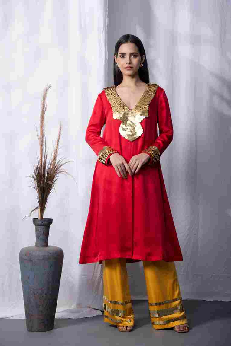 A model showcasing Red Sunboarding Kurta Set Feature image by Kanika Verma Couture from Kanika Verma Couture's collection