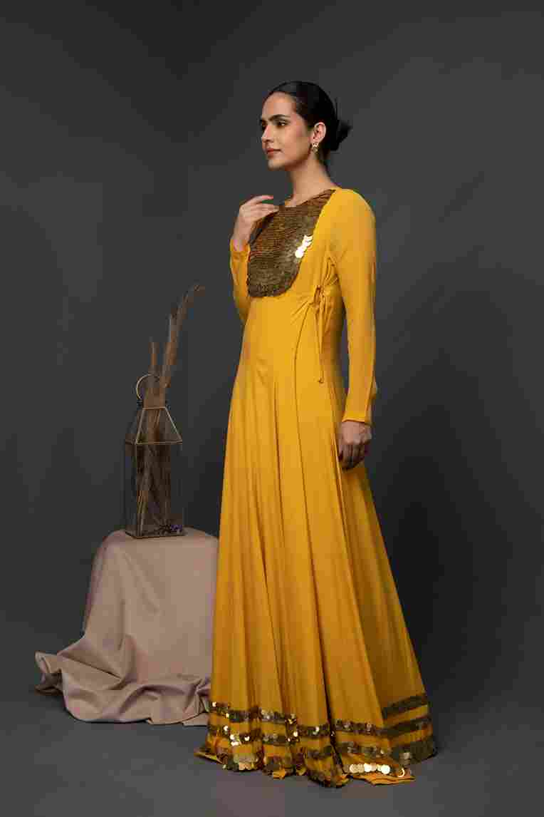 A model showcasing Fujairan Long Angrakha by Kanika Verma Couture from Kanika Verma Couture's collection