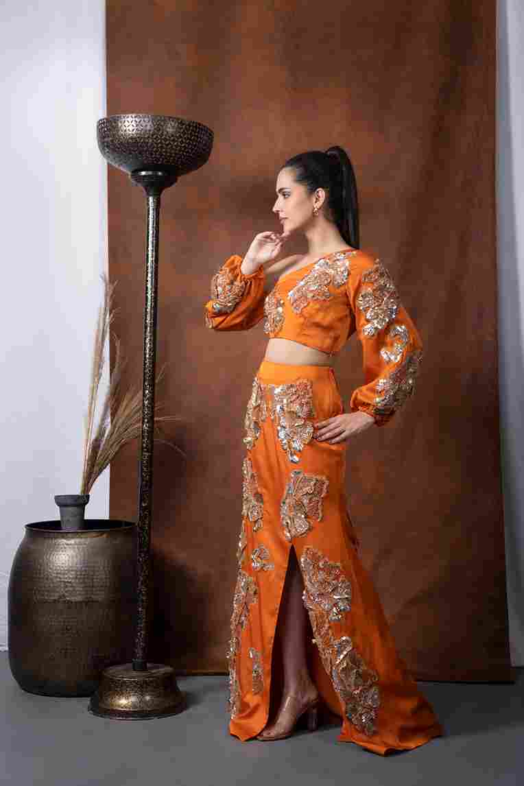 A model showcasing Arjwan Off Shoulder Top by Kanika Verma Couture from Kanika Verma Couture's collection