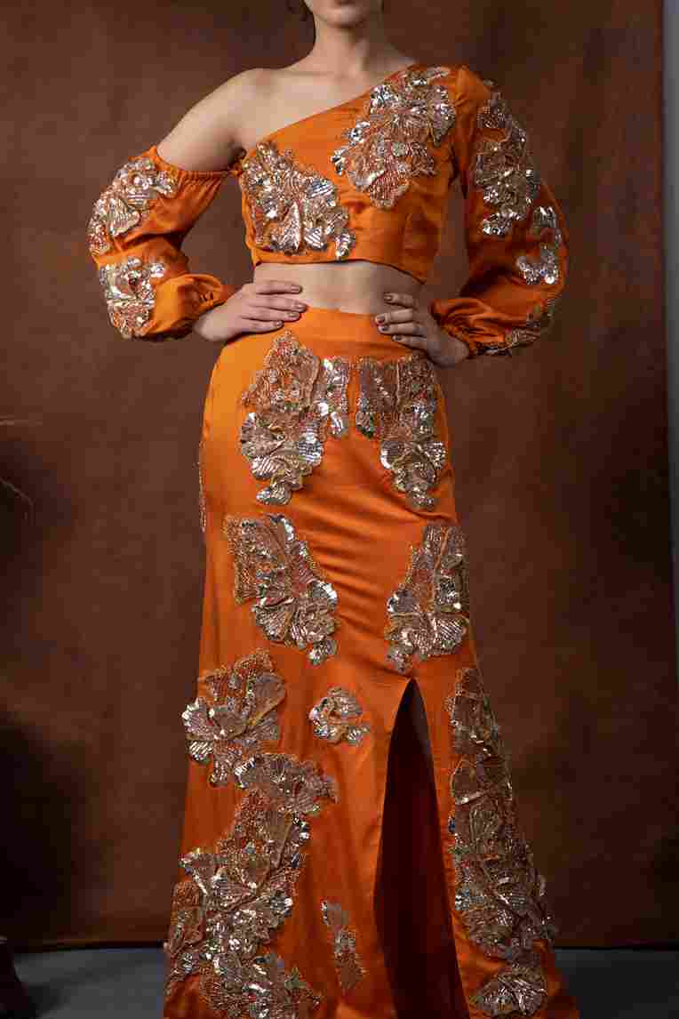 A model showcasing Arjwan Off Shoulder Top by Kanika Verma Couture from Kanika Verma Couture's collection