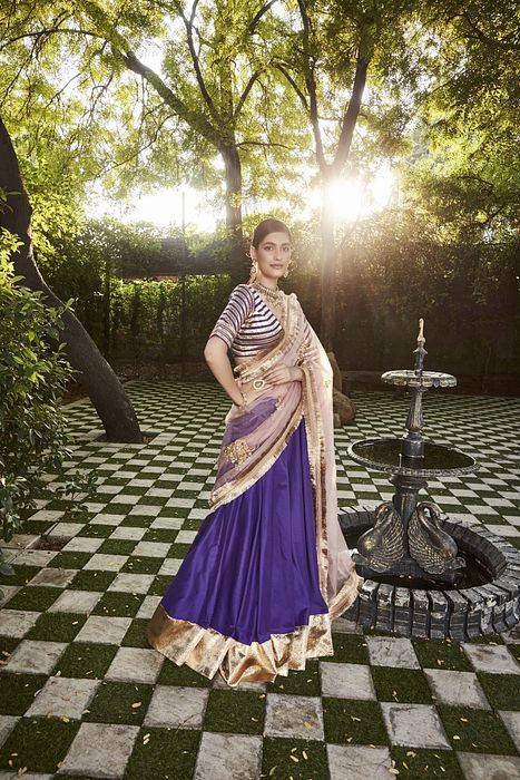 A model showcasing Purple Silk Lehenga by Ranian from Ranian's collection A model showcasing Purple Silk Lehenga by Ranian from Ranian's collection
