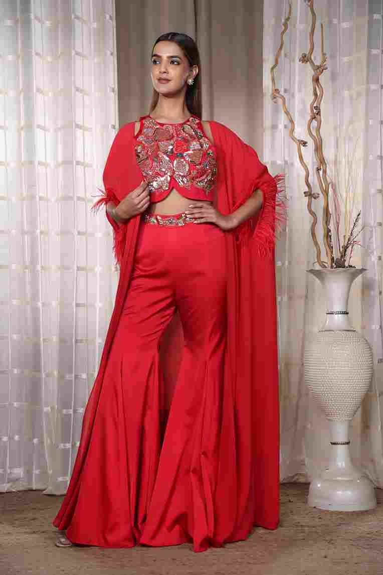 A model showcasing Red Aldubai Garara by Kanika Verma Couture from Kanika Verma Couture's collection