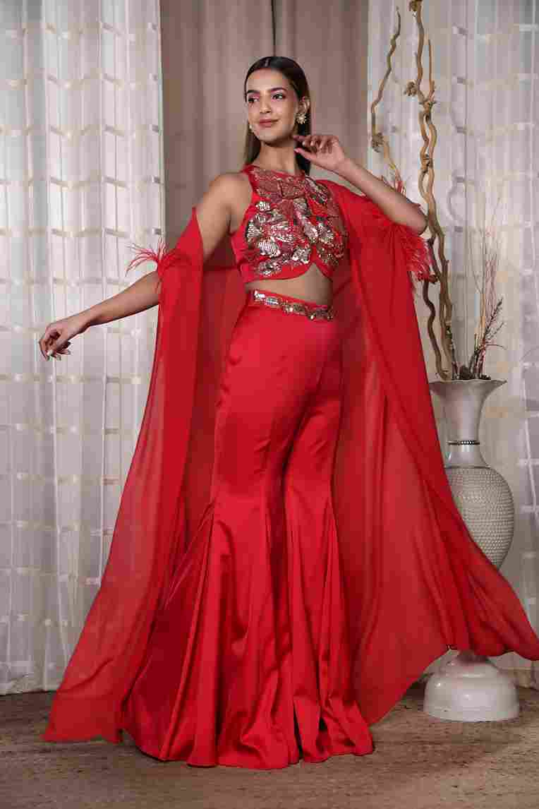 A model showcasing Red Aldubai Garara Feature image by Kanika Verma Couture from Kanika Verma Couture's collection
