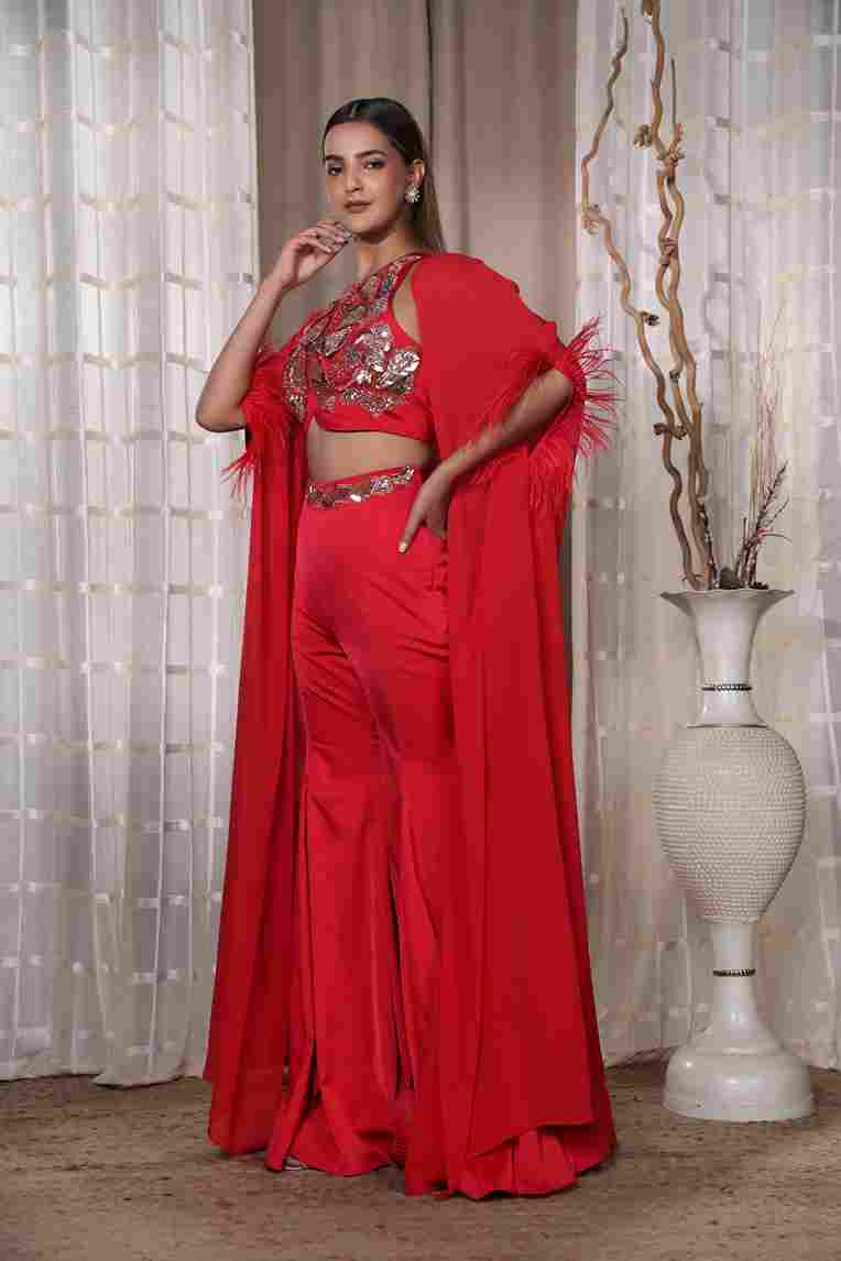 A model showcasing Red Aldubai Garara by Kanika Verma Couture from Kanika Verma Couture's collection