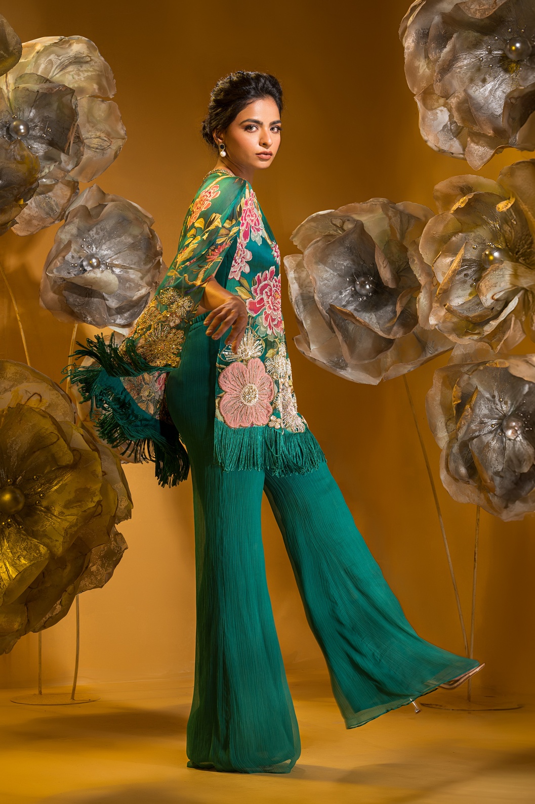 A model showcasing Printed Embroidered Cape And Flared Pant by Q By Sonia Baderia from Q By Sonia Baderia's collection