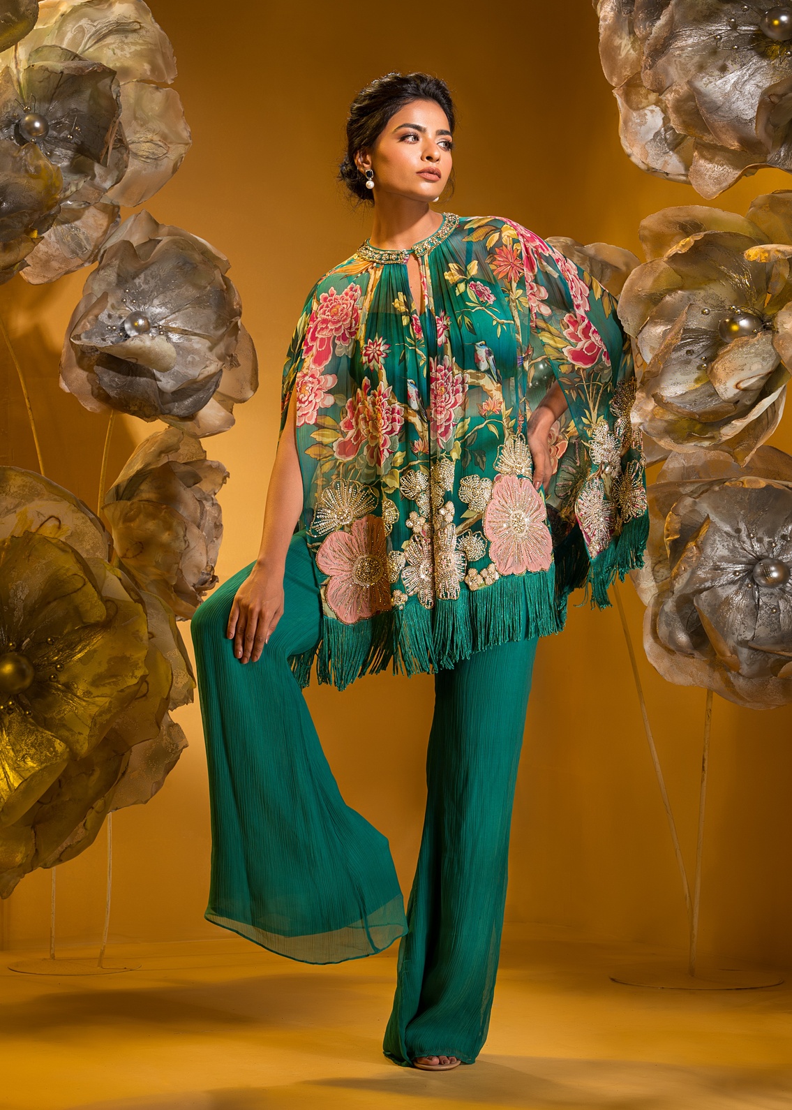 A model showcasing Printed Embroidered Cape And Flared Pant by Q By Sonia Baderia from Q By Sonia Baderia's collection