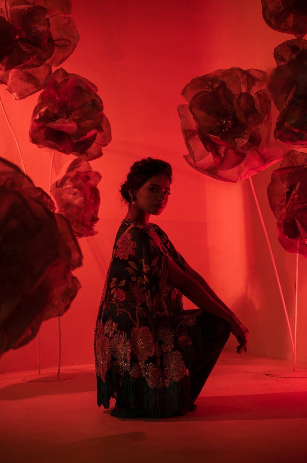 A model showcasing Printed Embroidered Cape And Flared Pant by Q By Sonia Baderia from Q By Sonia Baderia's collection