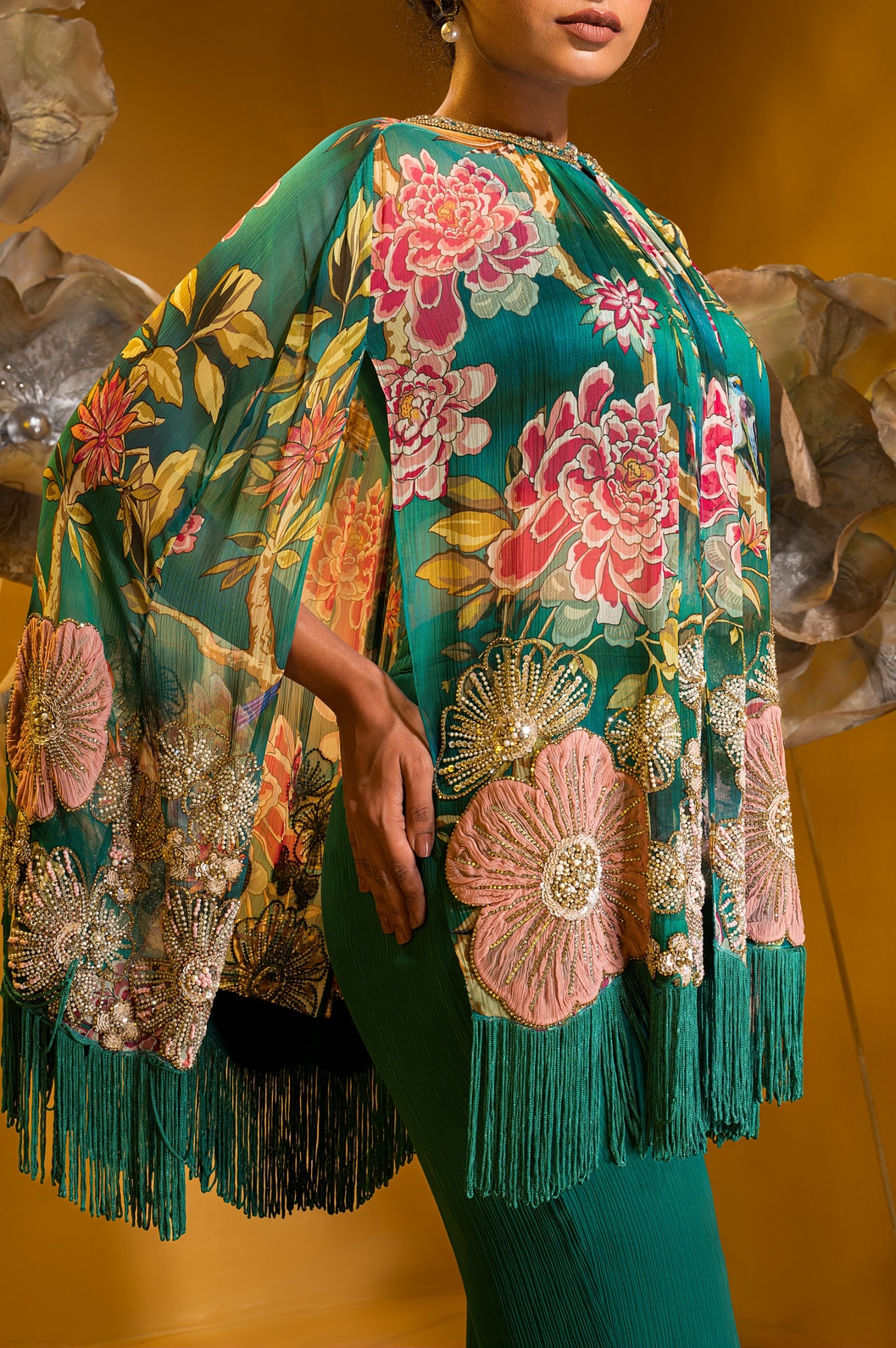 A model showcasing Printed Embroidered Cape And Flared Pant by Q By Sonia Baderia from Q By Sonia Baderia's collection