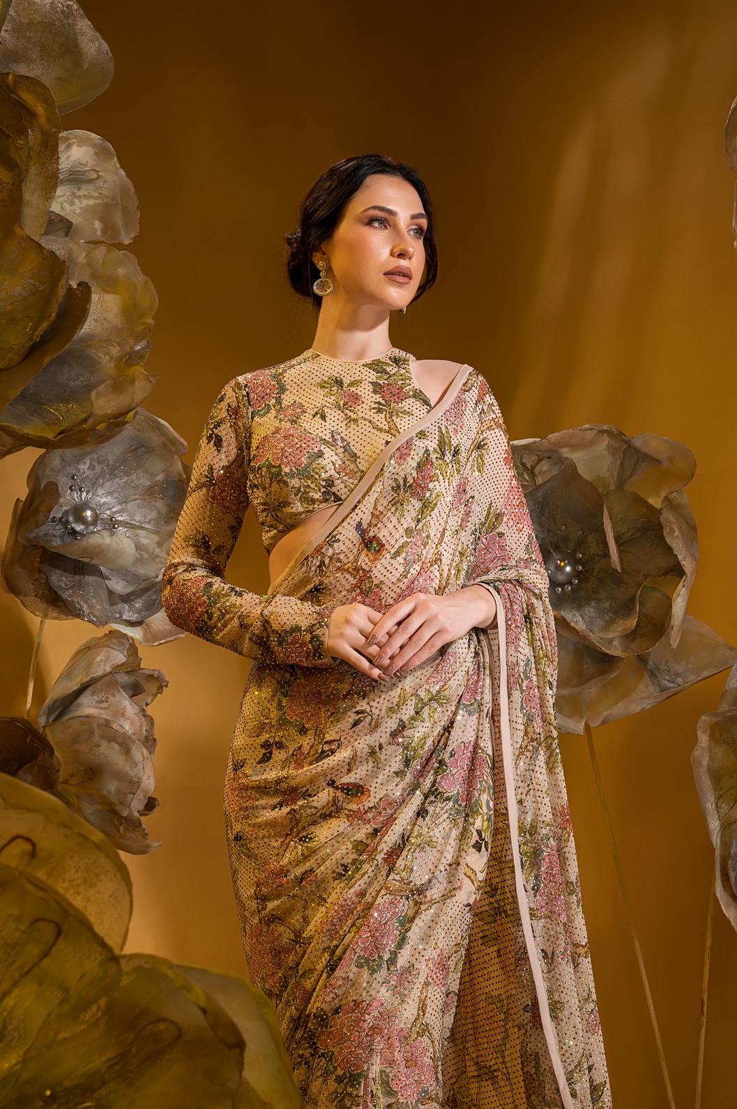 A model showcasing Printed Beige Saree With One Sleeve Blouse by Q By Sonia Baderia from Q By Sonia Baderia's collection