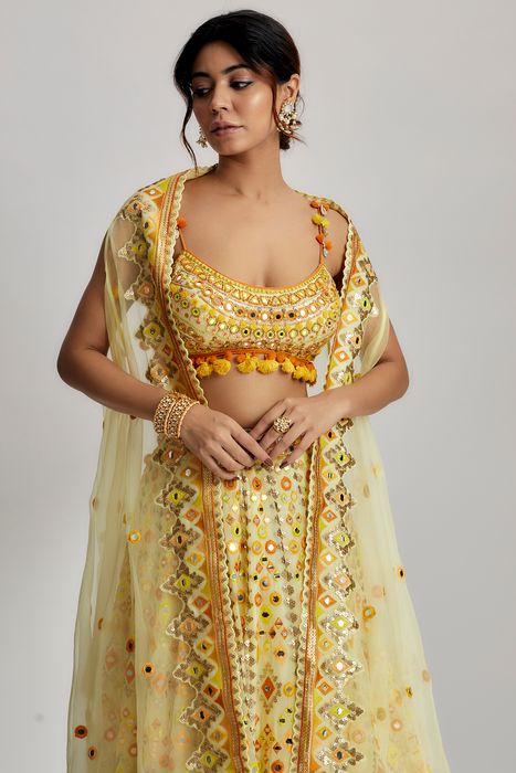 A model showcasing Yellow Ashi Lehenga With Cape Set by Gopi Vaid from Gopi Vaid's collection