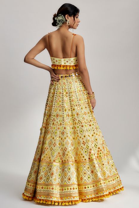A model showcasing Yellow Ashi Lehenga With Cape Set by Gopi Vaid from Gopi Vaid's collection