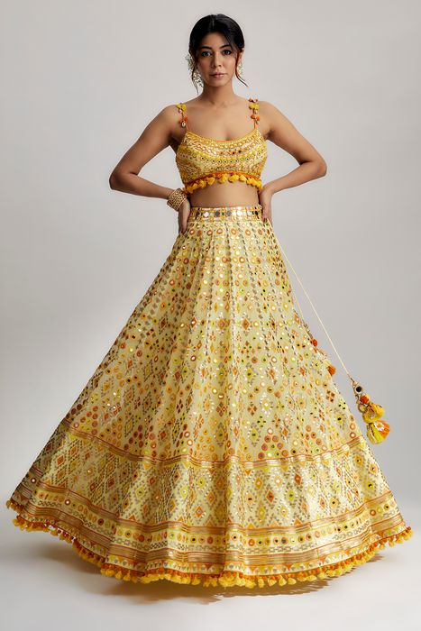 A model showcasing Yellow Ashi Lehenga With Cape Set by Gopi Vaid from Gopi Vaid's collection