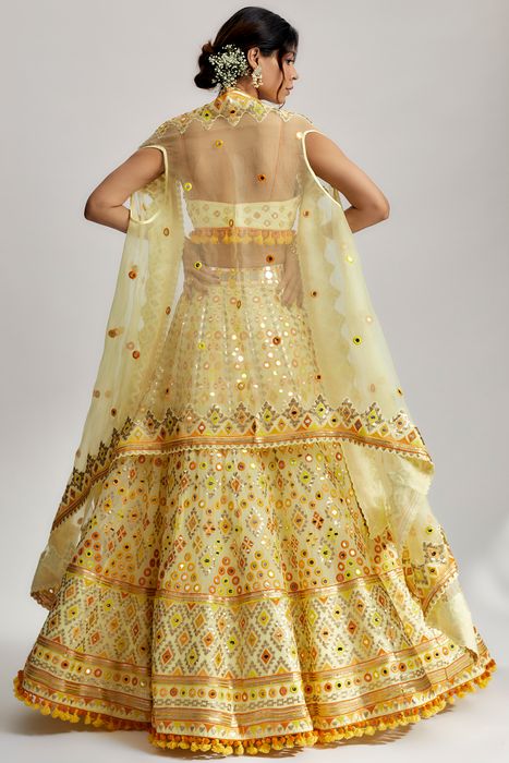 A model showcasing Yellow Ashi Lehenga With Cape Set by Gopi Vaid from Gopi Vaid's collection