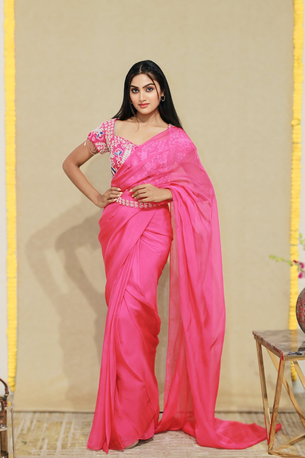 A model showcasing Rangoli Pink Drape Saree by Kanika Verma Couture from Kanika Verma Couture's collection