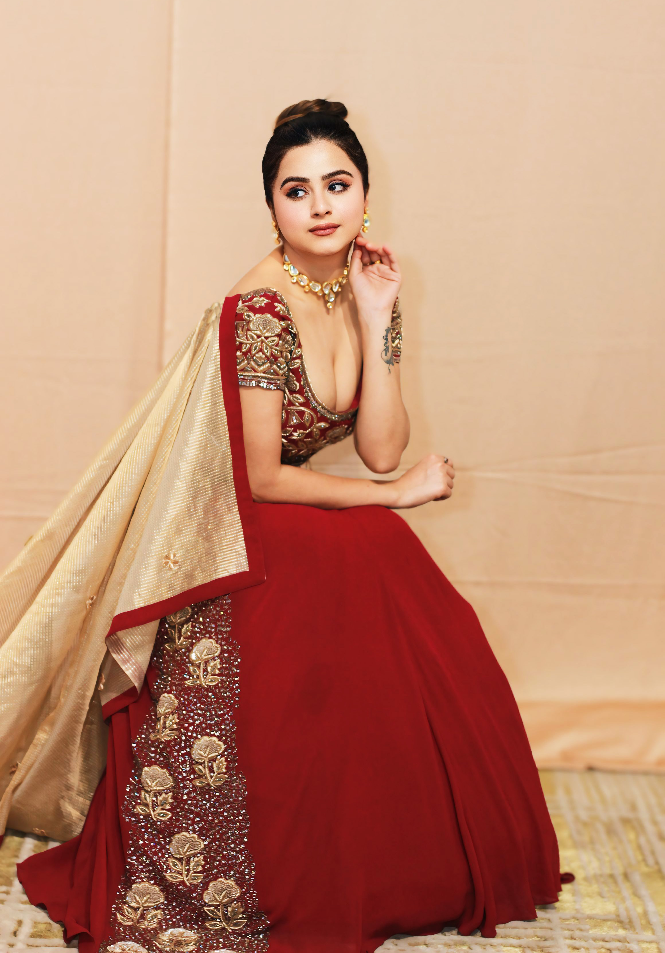 A model showcasing Noorani Wine Lehnga by Kanika Verma Couture from Kanika Verma Couture's collection