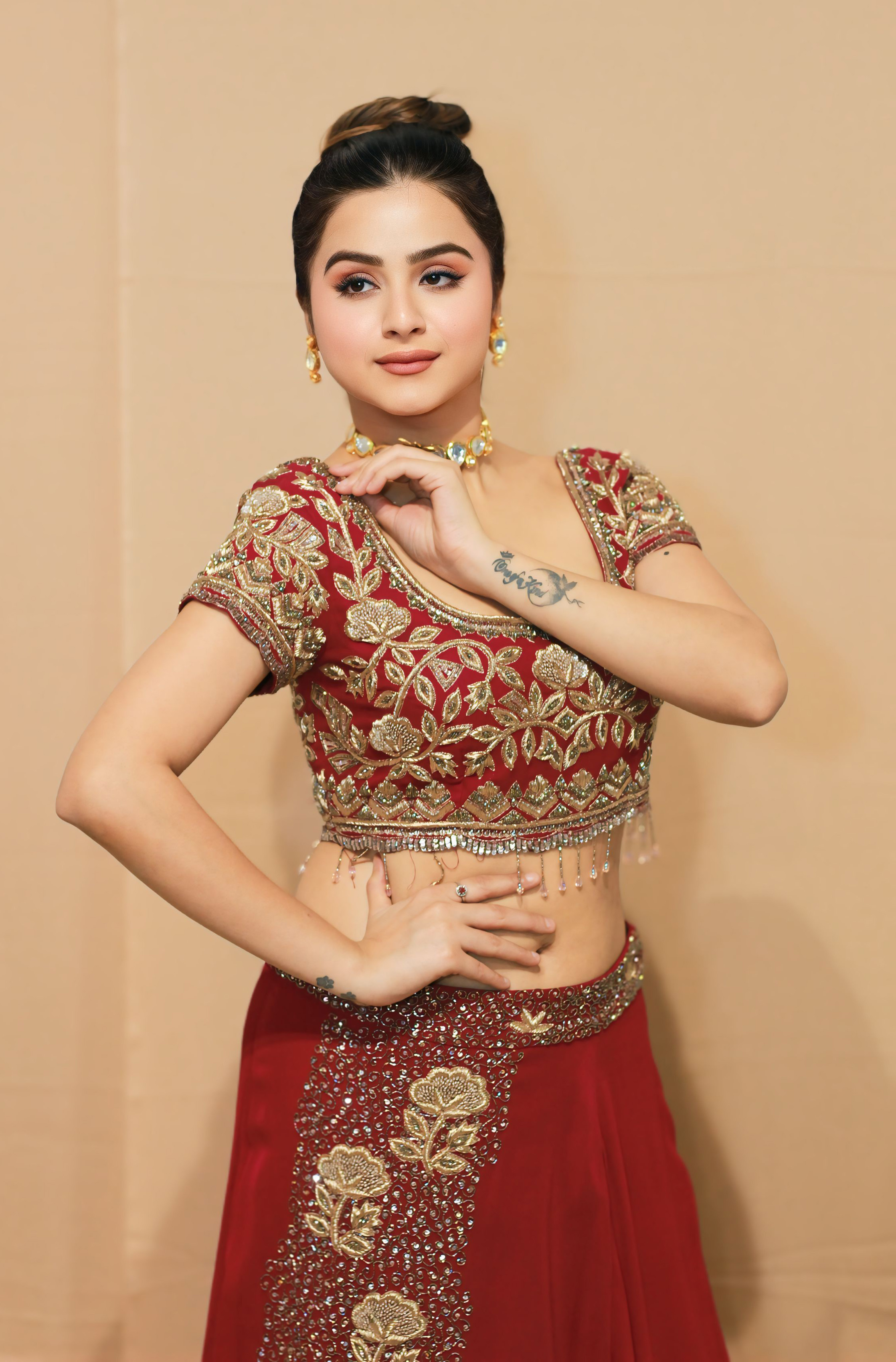 A model showcasing Noorani Wine Lehnga by Kanika Verma Couture from Kanika Verma Couture's collection