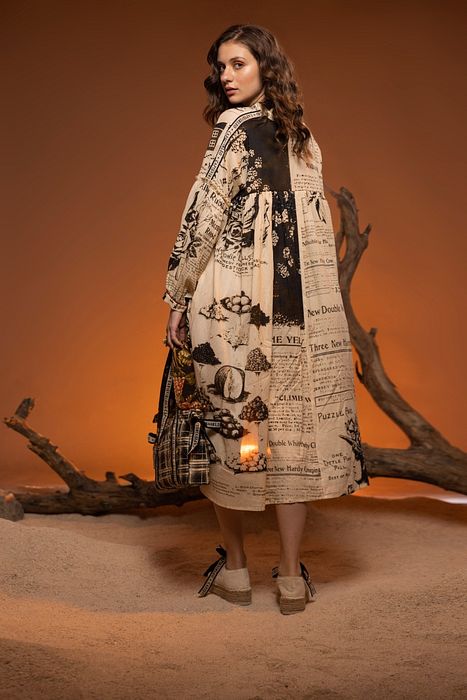 A model showcasing Ivory Black Alder Dress by Capisvirleo from Capisvirleo's collection