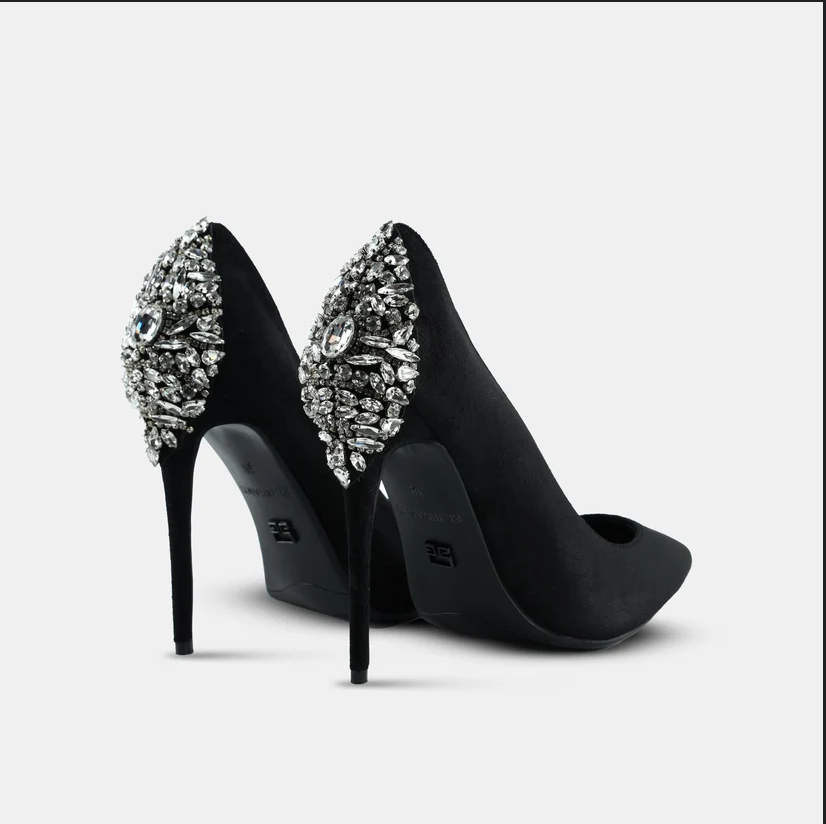 A model showcasing Suede Leather Pointed Toe Pumps by Elleganti from Elleganti's collection A model showcasing Suede Leather Pointed Toe Pumps by Elleganti from Elleganti's collection