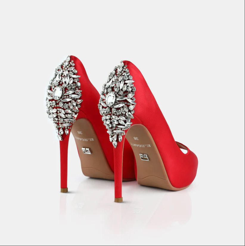 A model showcasing Red Satin Open Toe Platform Pumps by Elleganti from Elleganti's collection
