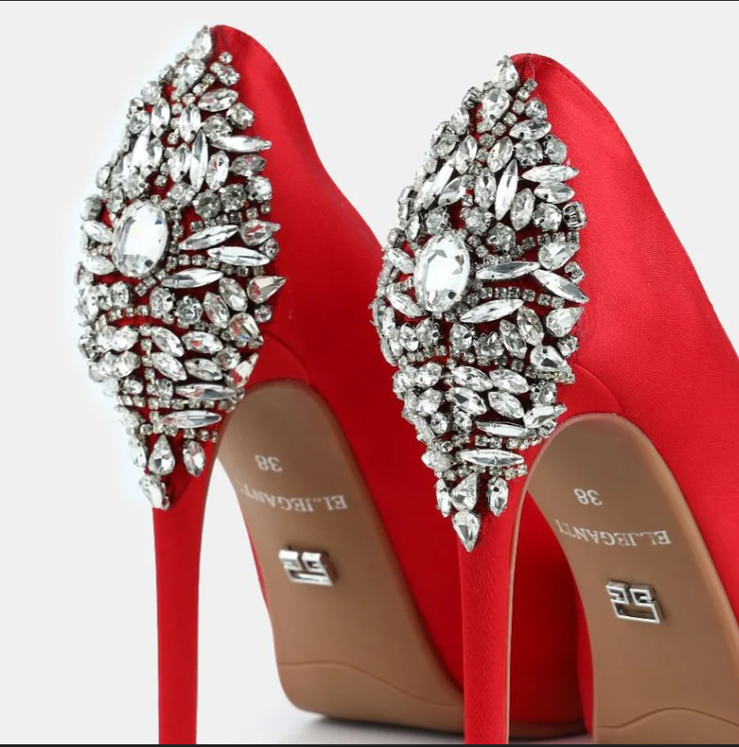 A model showcasing Red Satin Open Toe Platform Pumps by Elleganti from Elleganti's collection