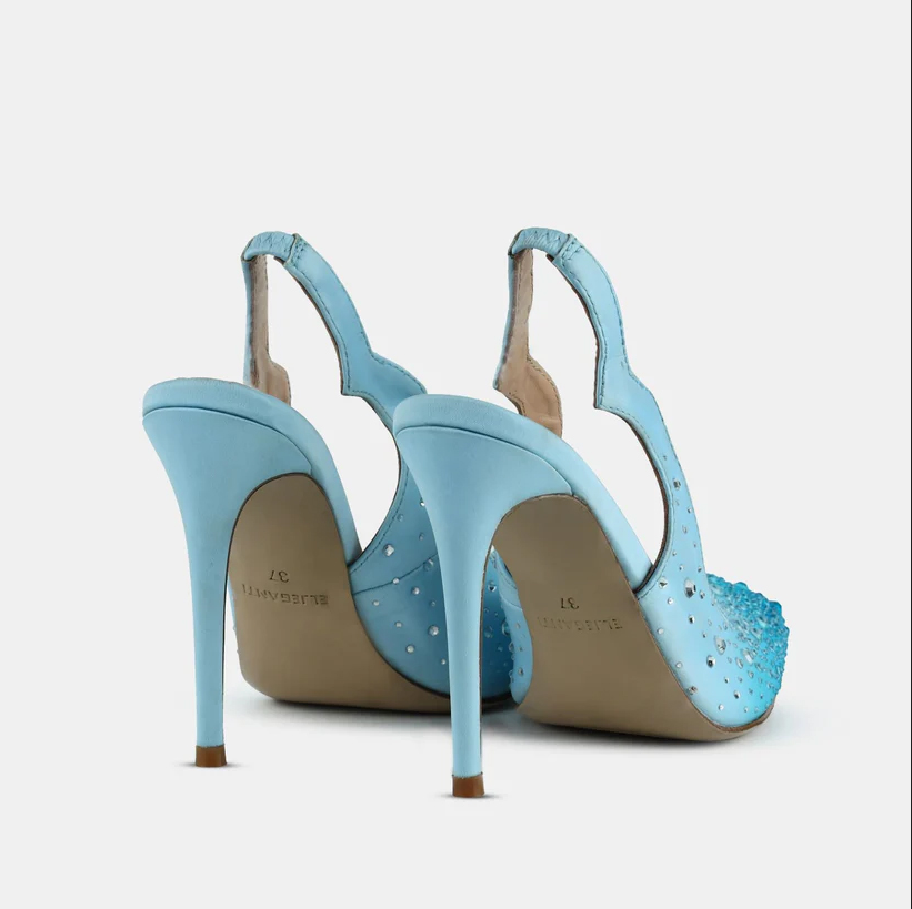 A model showcasing Crystal Pointed Toe Sling Back Pumps by Elleganti from Elleganti's collection A model showcasing Crystal Pointed Toe Sling Back Pumps by Elleganti from Elleganti's collection