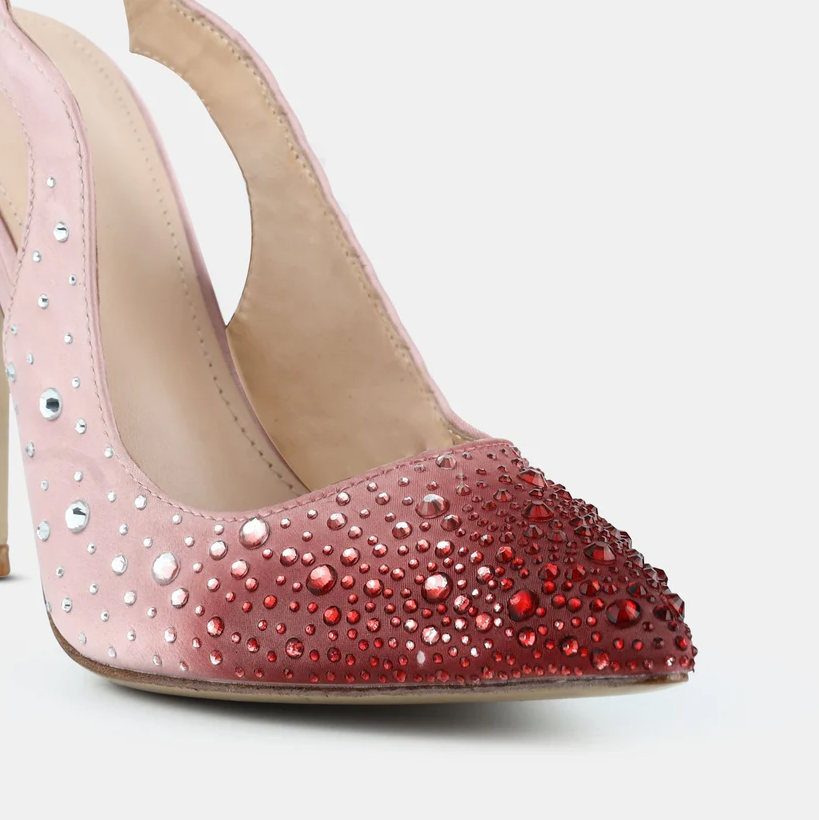 A model showcasing Embellished Pointed Toe Sling Back Pumps by Elleganti from Elleganti's collection A model showcasing Embellished Pointed Toe Sling Back Pumps by Elleganti from Elleganti's collection
