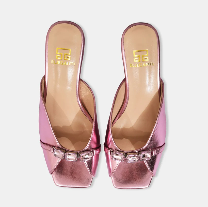 A model showcasing Mauve Blush Metallic Leather Sandals With Crystal Heel by Elleganti from Elleganti's collection A model showcasing Mauve Blush Metallic Leather Sandals With Crystal Heel by Elleganti from Elleganti's collection
