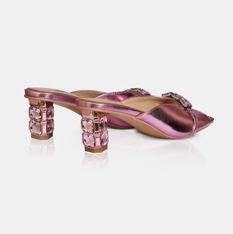 A model showcasing Mauve Blush Metallic Leather Sandals With Crystal Heel by Elleganti from Elleganti's collection A model showcasing Mauve Blush Metallic Leather Sandals With Crystal Heel by Elleganti from Elleganti's collection