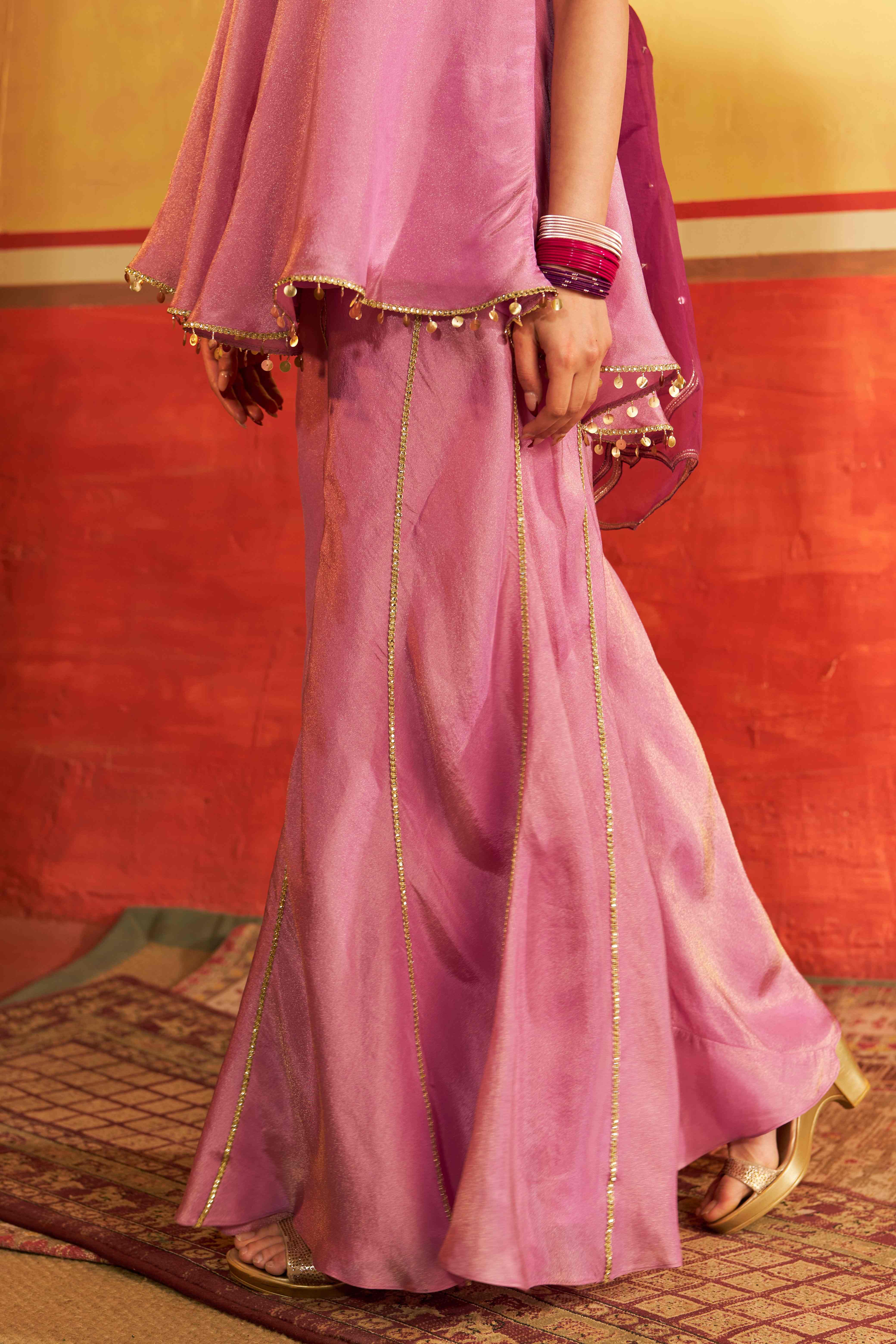 A model showcasing Sangam Lavender Sharara Set by Gaamya from Gaamya's collection