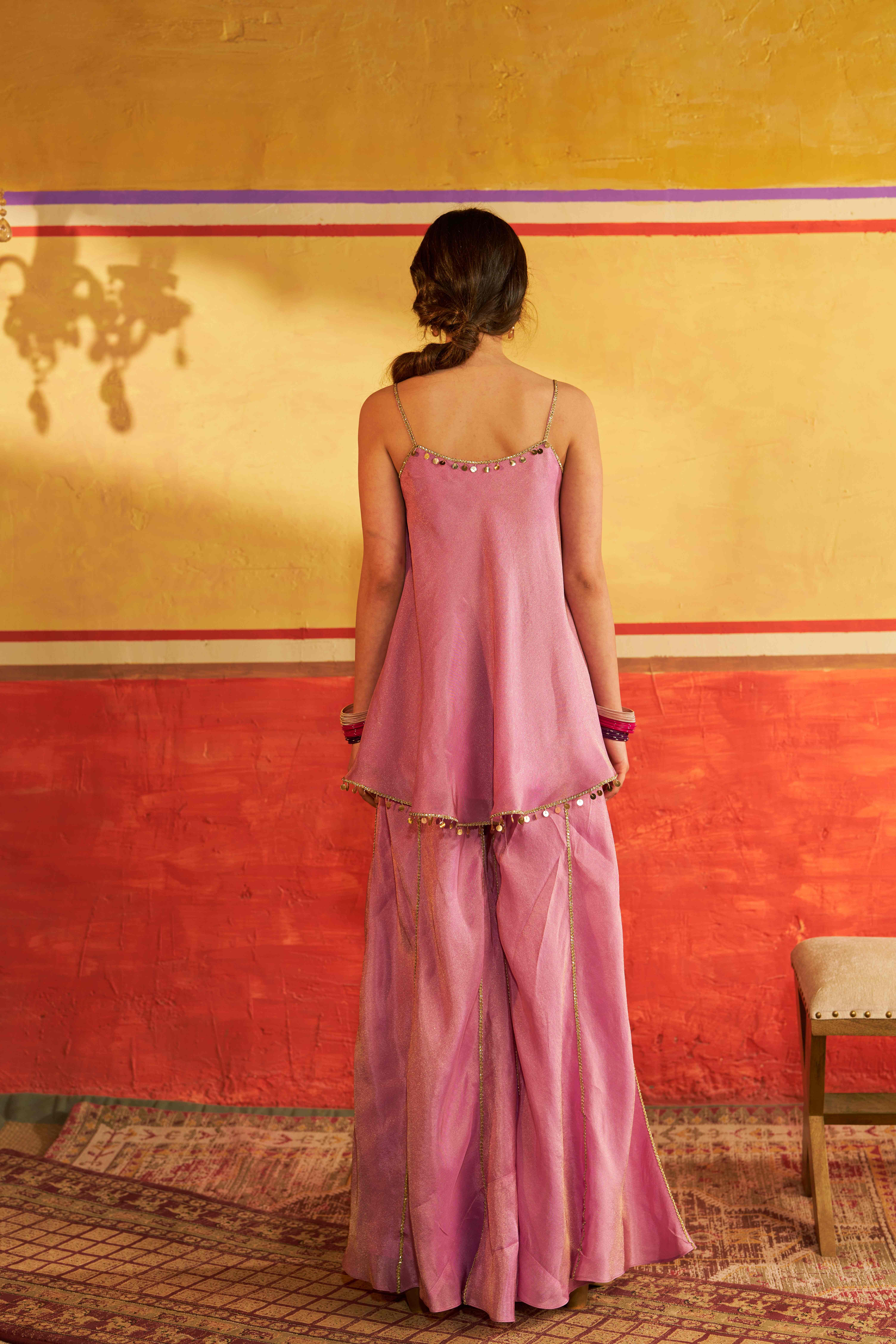 A model showcasing Sangam Lavender Sharara Set by Gaamya from Gaamya's collection