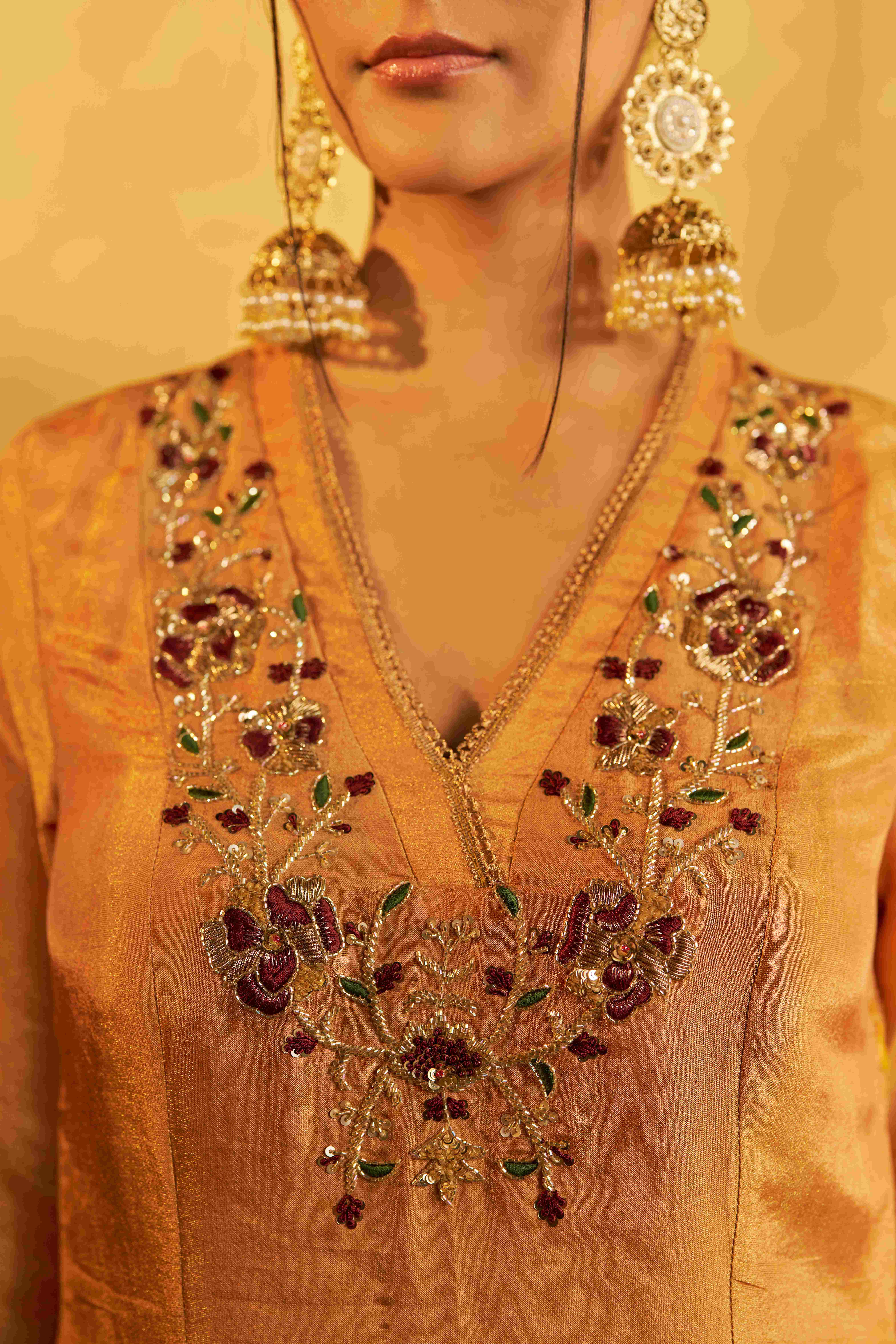 A model showcasing Meera Golden Kurta Set With Dupatta by Gaamya from Gaamya's collection