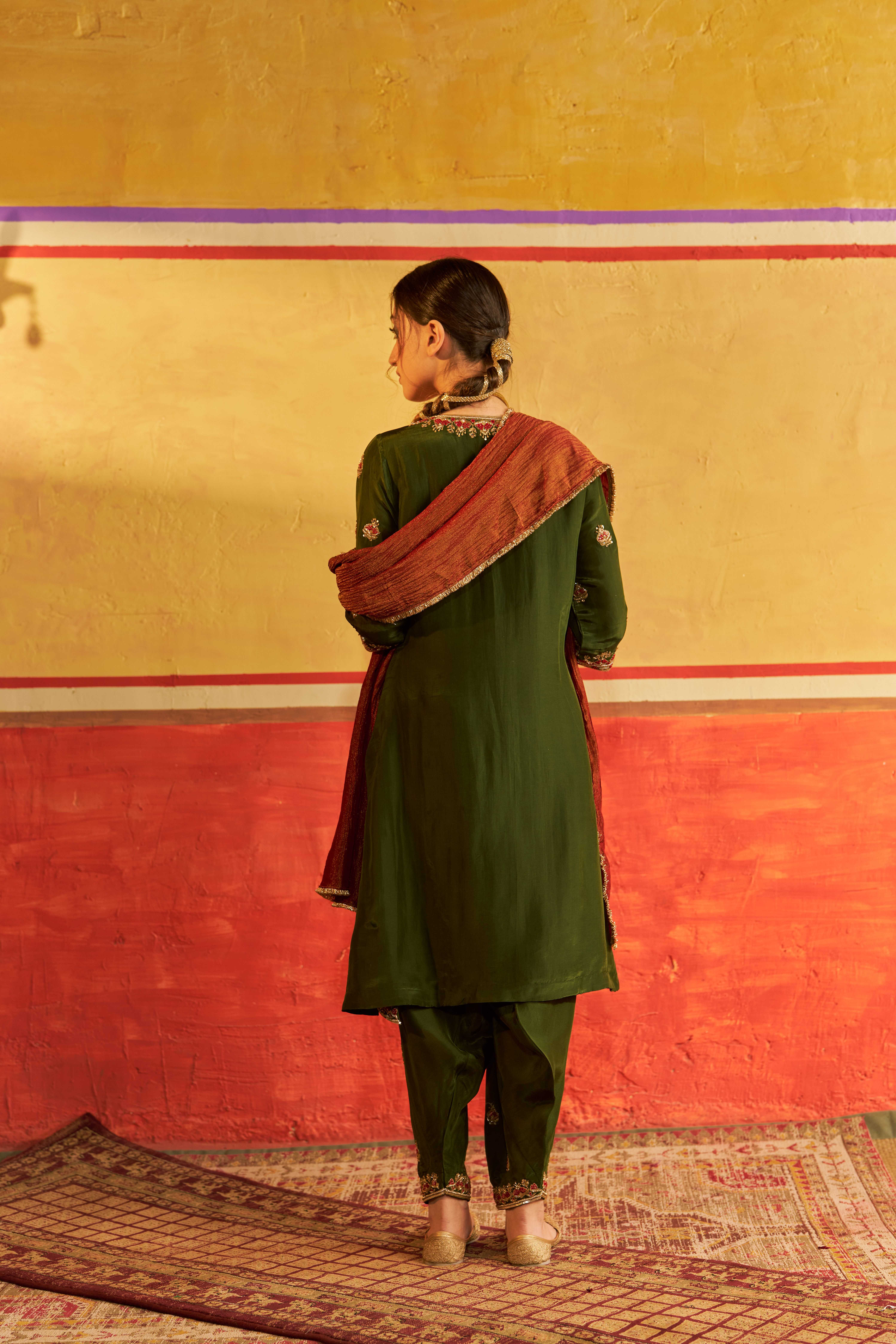 A model showcasing Sahiba Mehendi Green Suit With Dupatta by Gaamya from Gaamya's collection