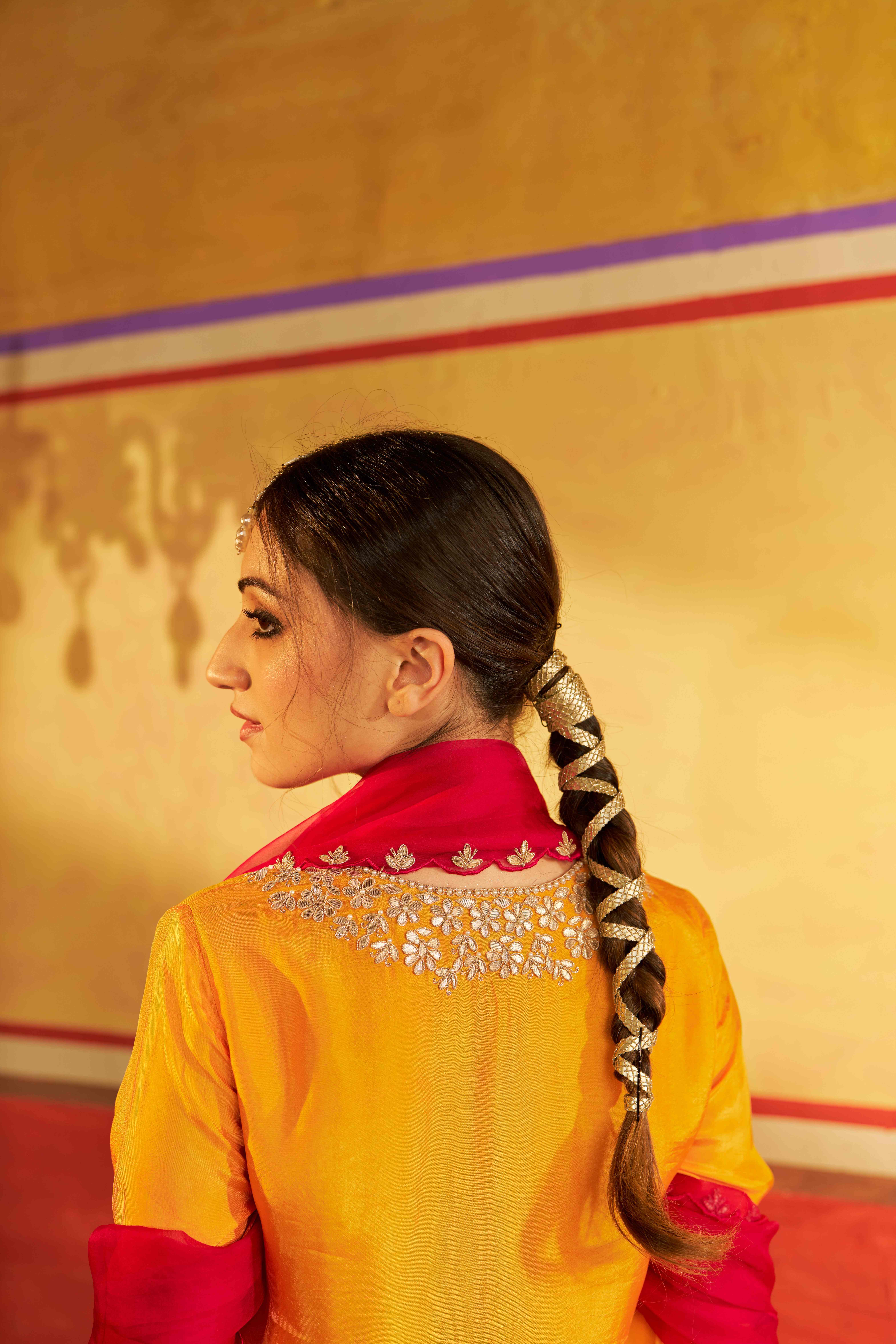A model showcasing Miraas Yellow Kurta Suit With Dupatta by Gaamya from Gaamya's collection