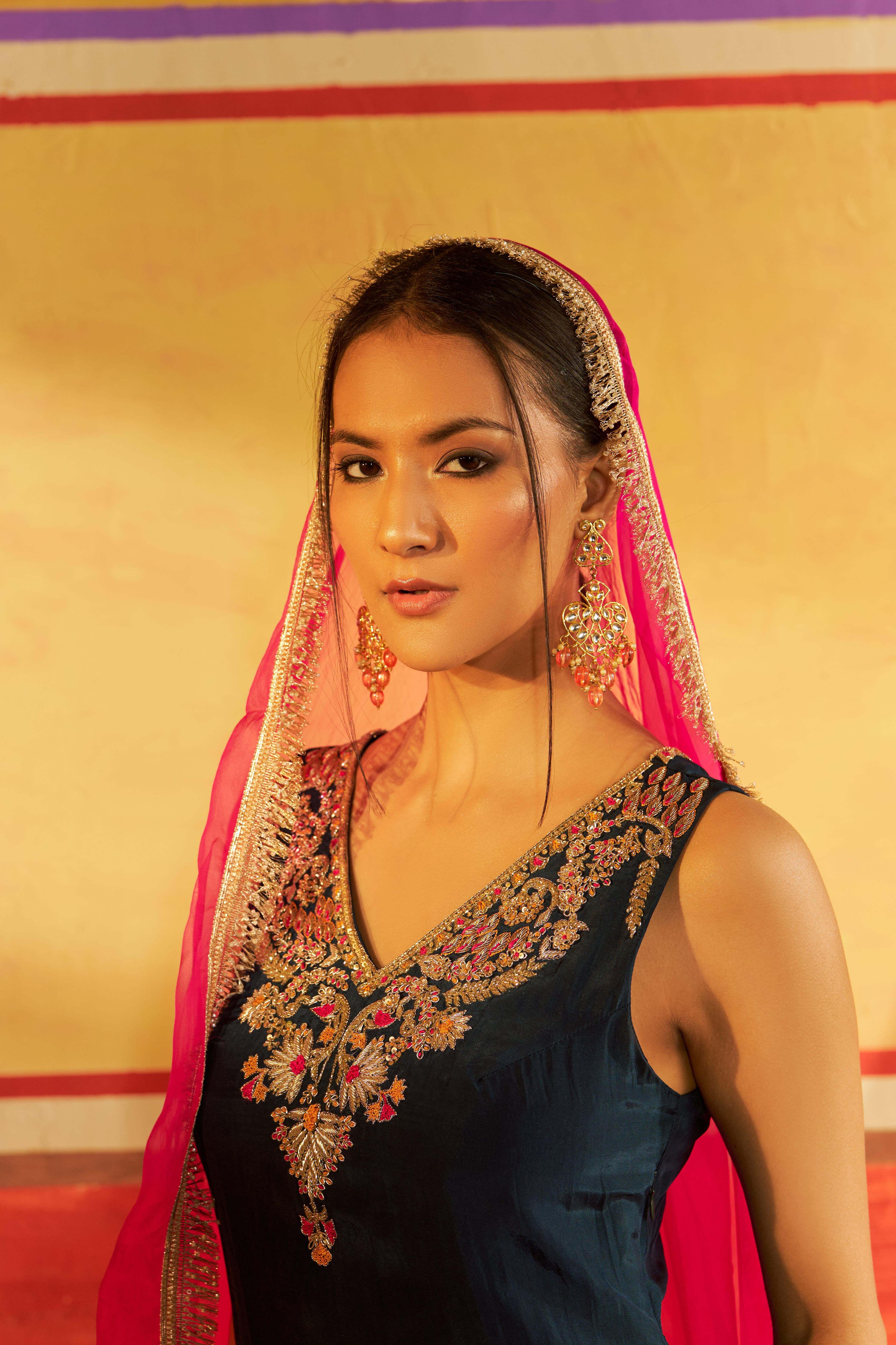 A model showcasing Saaz Navy Blue Sharara With Dupatta by Gaamya from Gaamya's collection