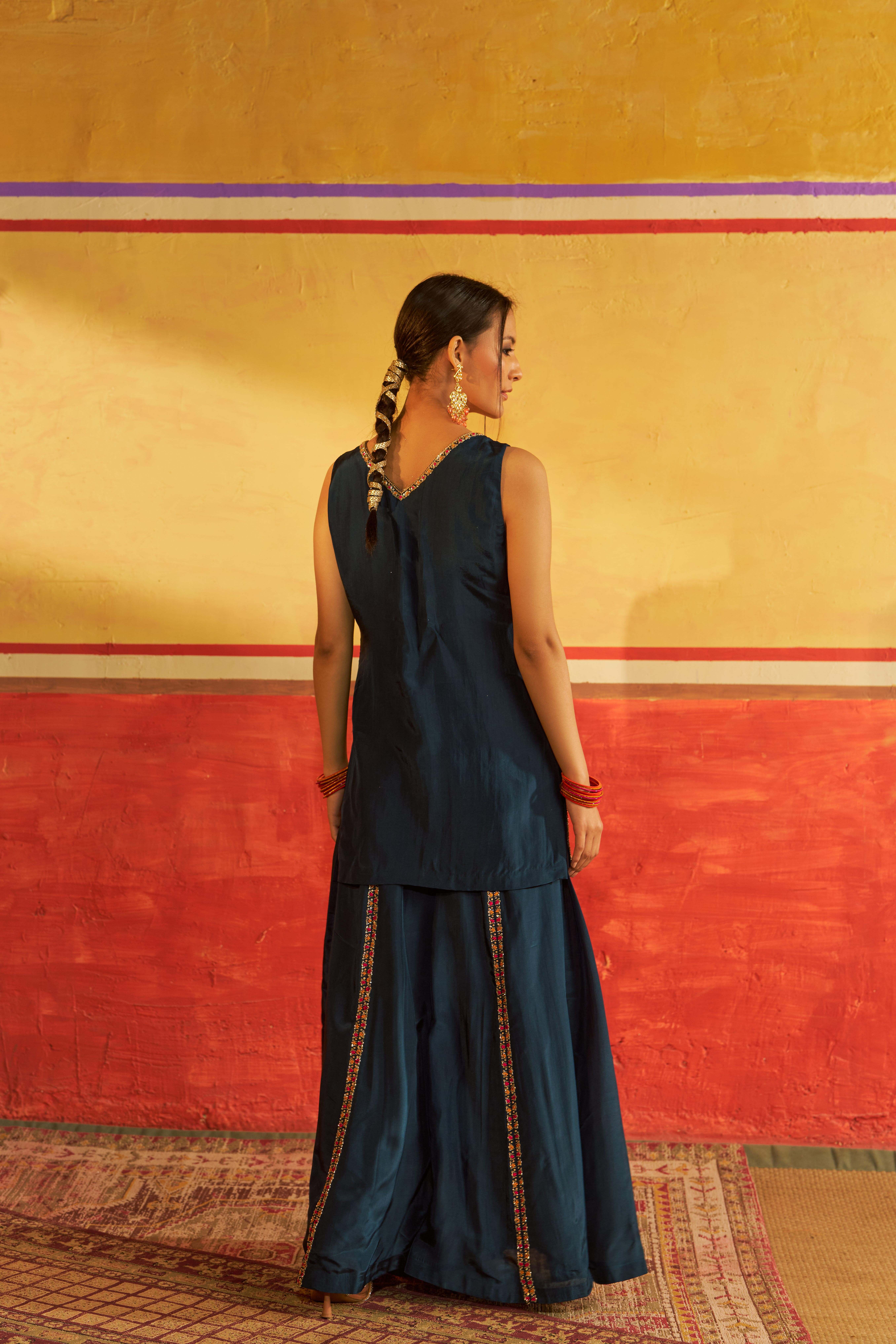 A model showcasing Saaz Navy Blue Sharara With Dupatta by Gaamya from Gaamya's collection
