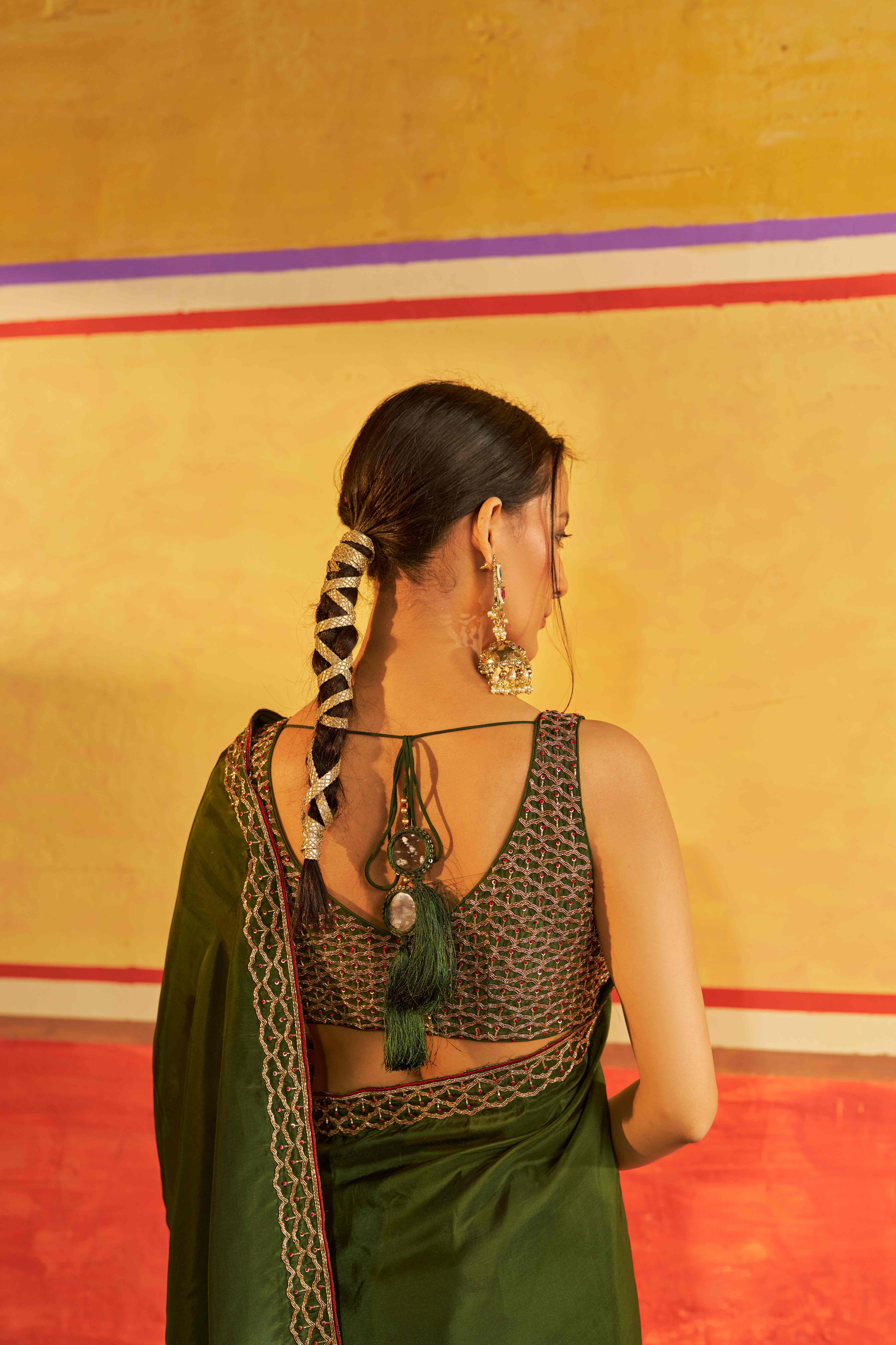 A model showcasing Chahat Mehendi Green Saree With Blouse by Gaamya from Gaamya's collection