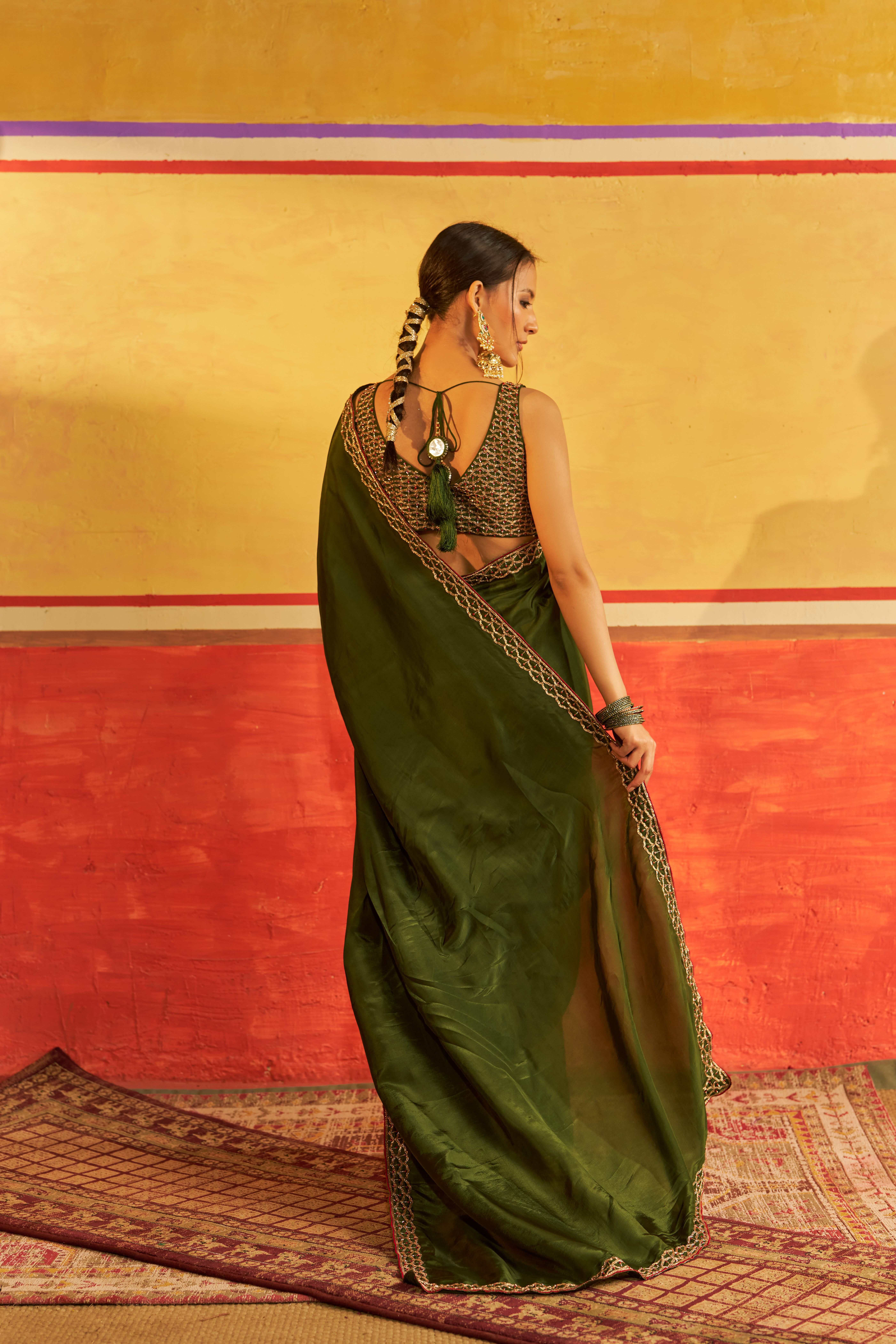 A model showcasing Chahat Mehendi Green Saree With Blouse by Gaamya from Gaamya's collection