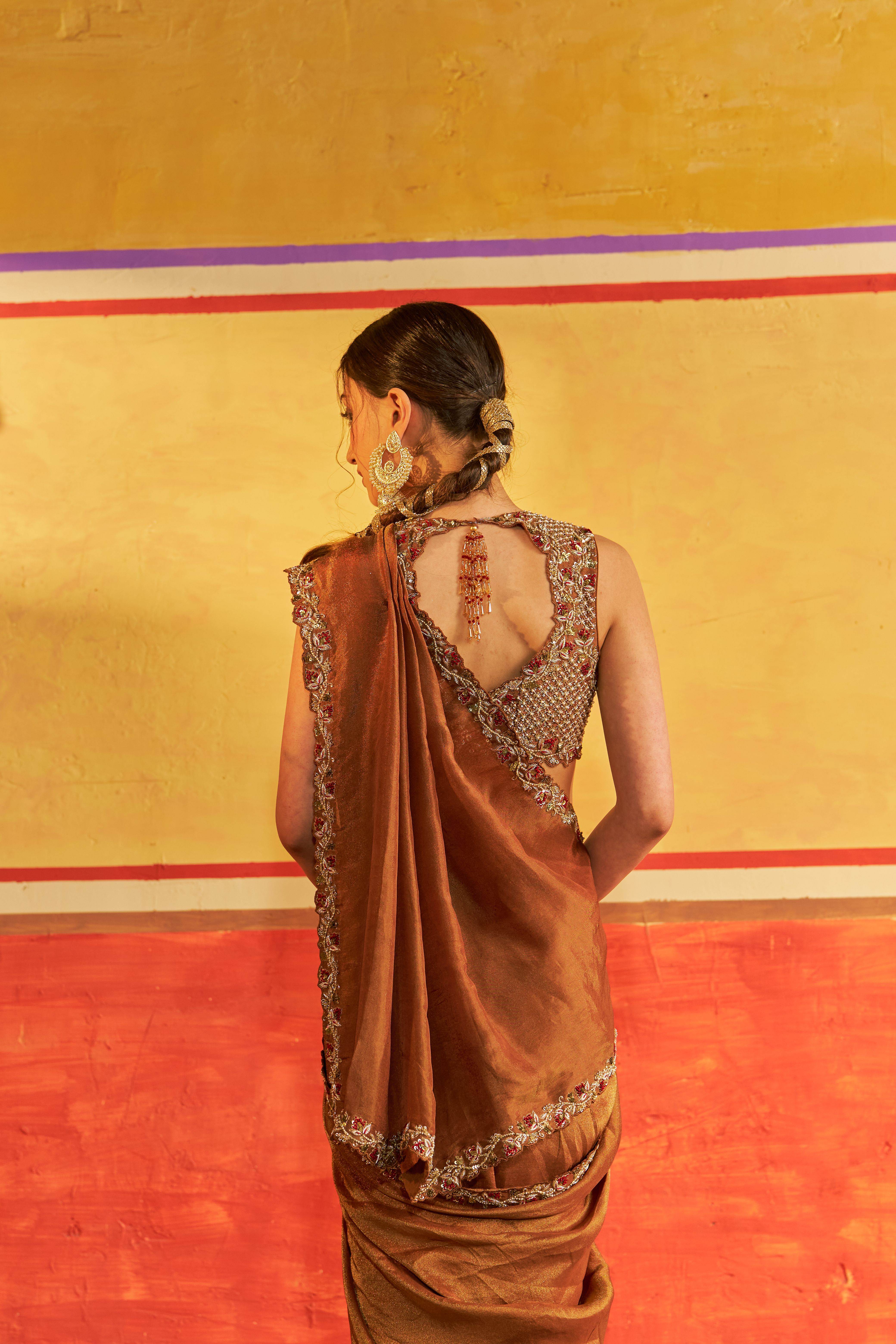 A model showcasing Gopi Light Golden Brown Saree With Blouse by Gaamya from Gaamya's collection