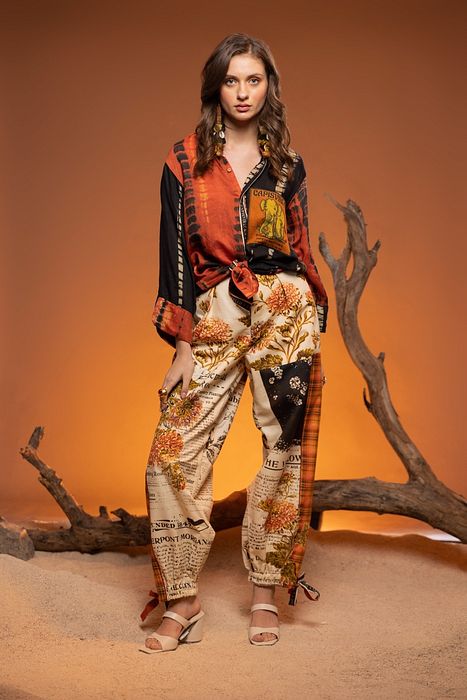 A model showcasing Ivory Cedar Pants by Capisvirleo from Capisvirleo's collection